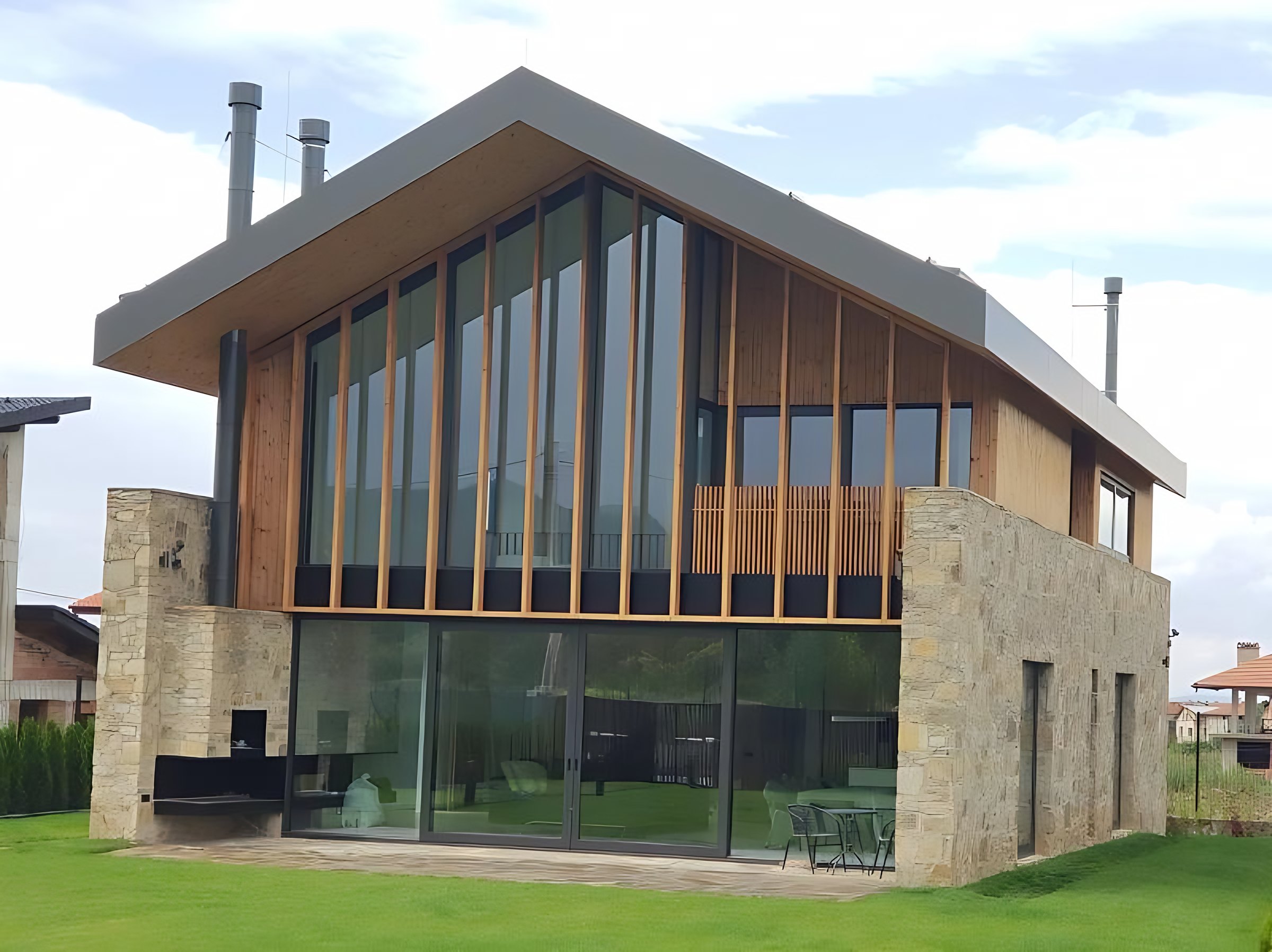 House with large sliding doors and windows by AVEL